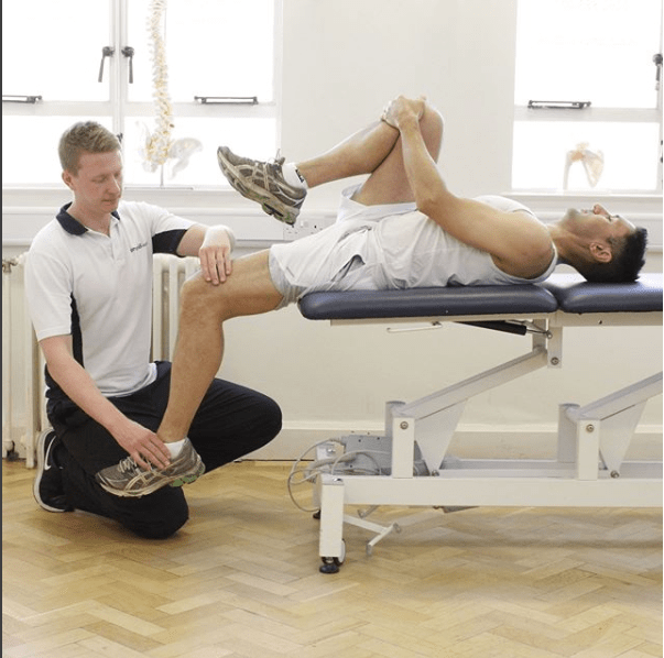 Man having physiotherapy on his knee.
