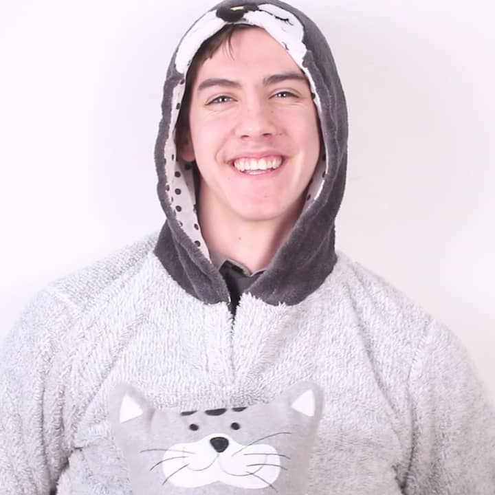 Portrait of James wearing cat themed onesie